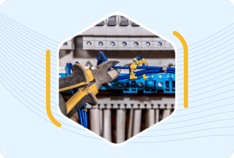 wire cutters holding wire about to be cut on switchboard